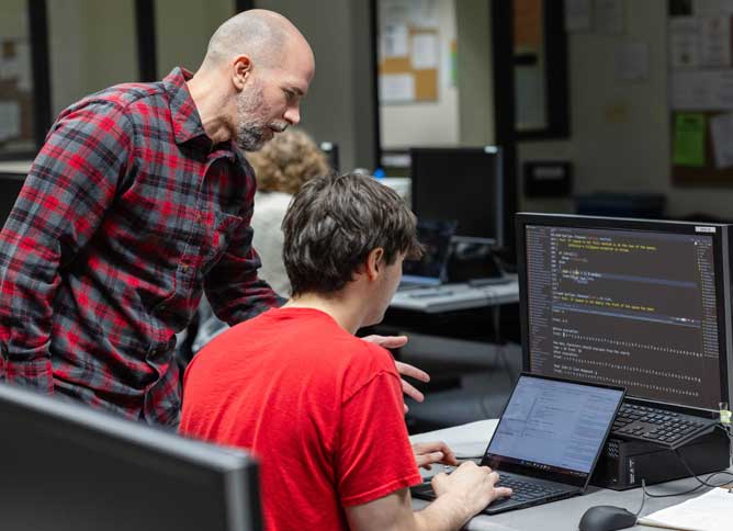 An Oakton professor helps a student.