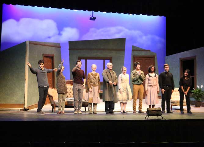 Theater crew standing onstage.