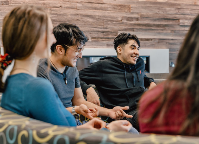 A group of Oakton students hang out in the student lounge.