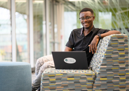 An Oakton College student smiles during a photograph.