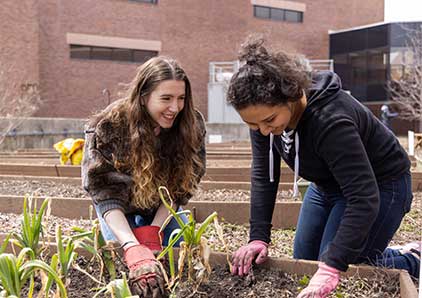 Two students in the community garden.