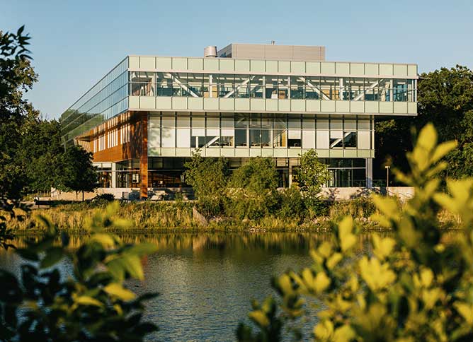 Lee Center building in Des Plaines, IL framed by foliage.